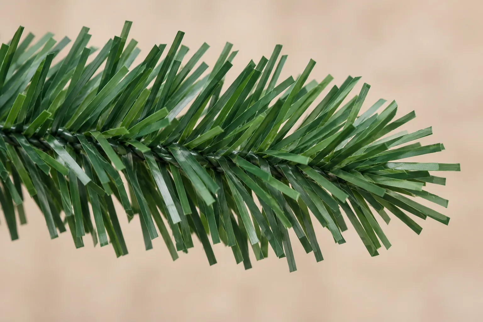 Illustration of flat cut PVC strips attached along an artificial Christmas tree branch