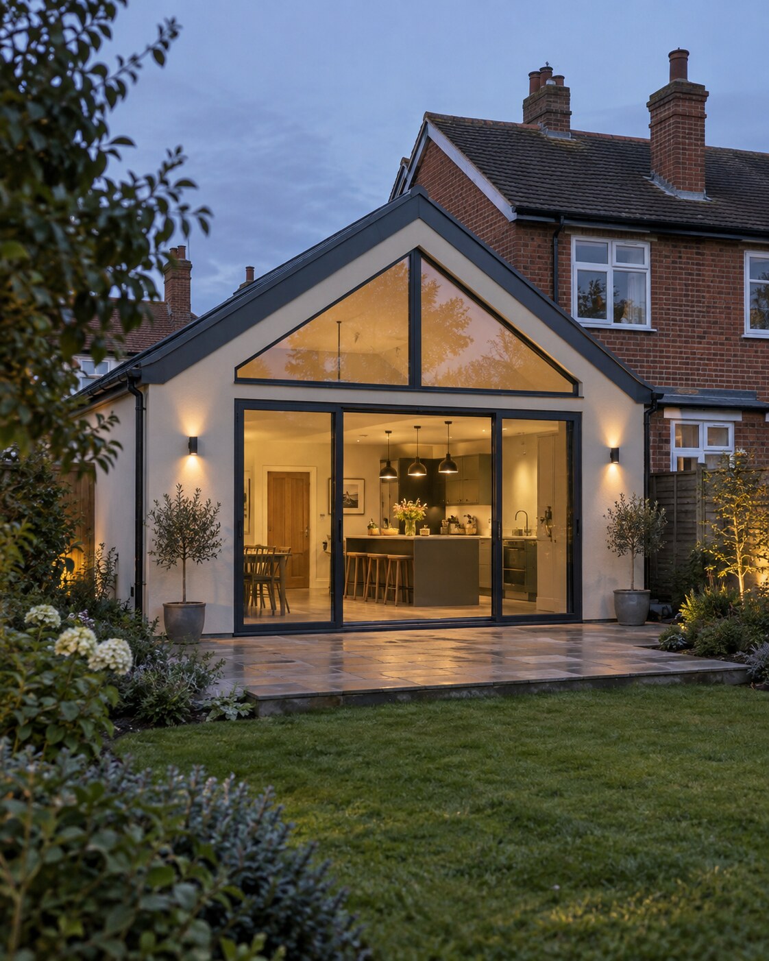 Gabled single-storey kitchen extension with triangular glazing